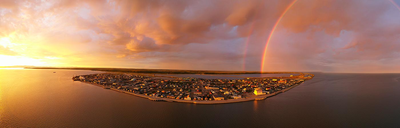 View of Kotzebue at sunset with rainbow