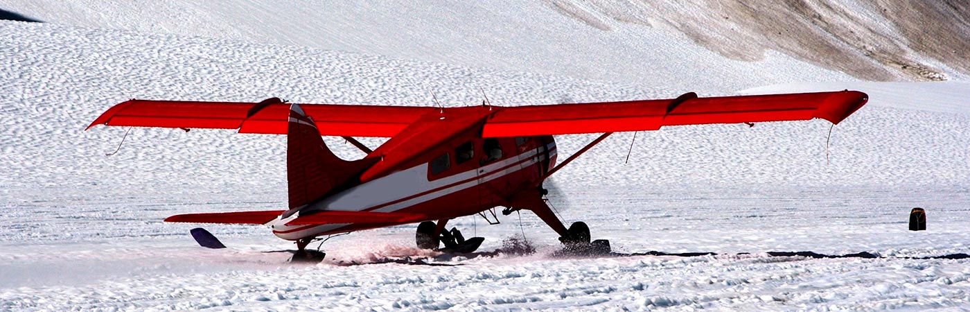 Red plane on glacier